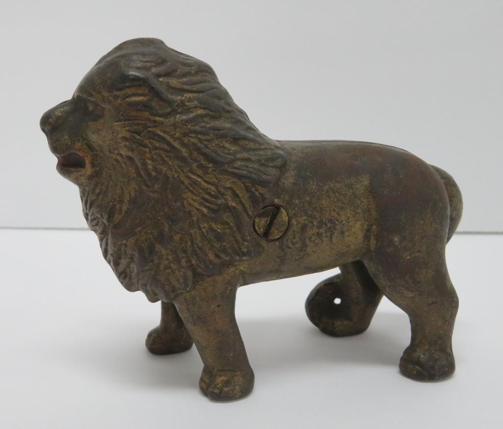 Standing Lion cast iron still bank, 4" tall and 5" long