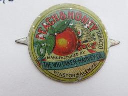 Five chewing tobacco tin tags, fruit design, 3/4" to 1 1/4"