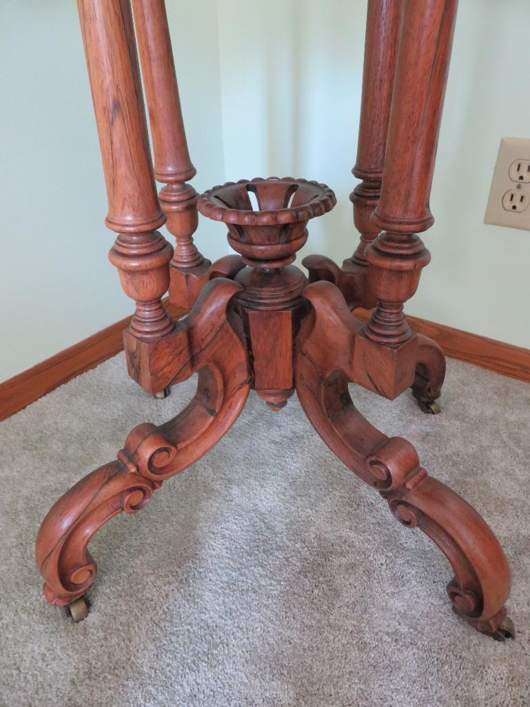 Unusual marble top table with salmon colored marble, walnut