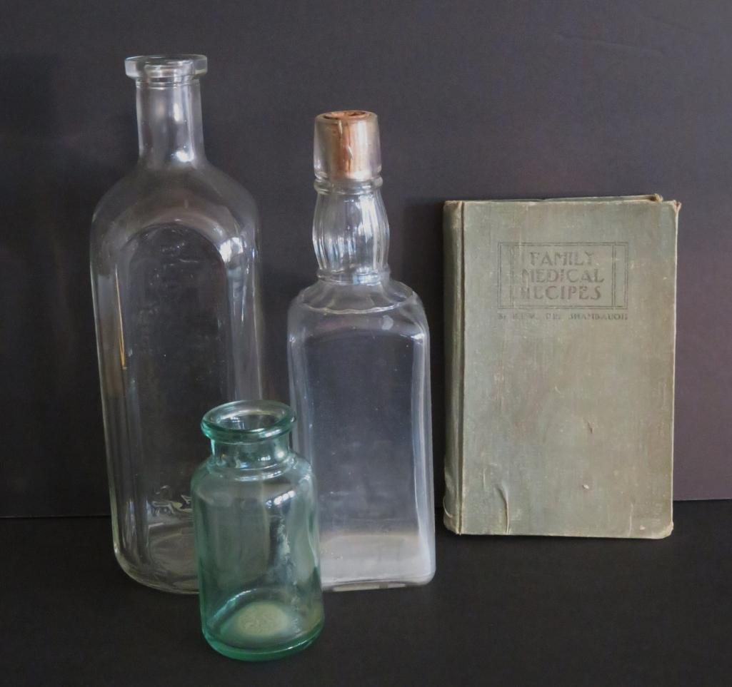Three medicinal bottles and Family Medical recipes book