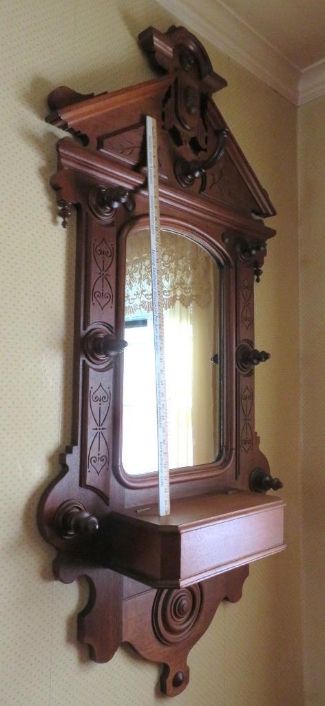 Ornately carved Walnut entry mirror with storage box