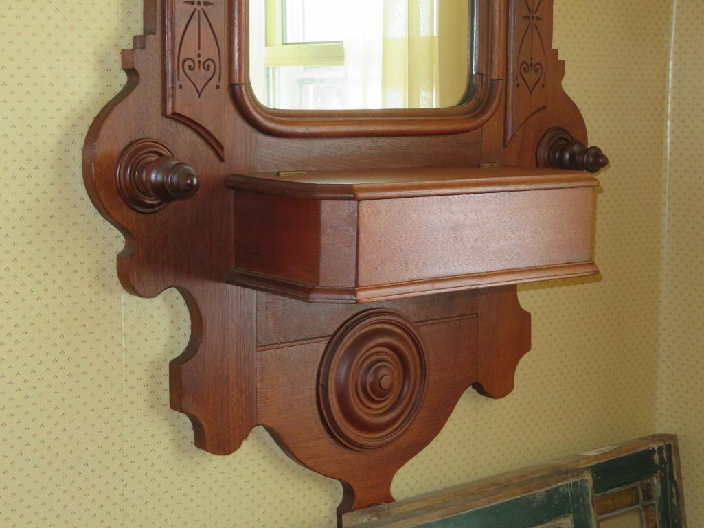Ornately carved Walnut entry mirror with storage box