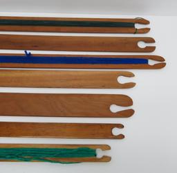 Seven wooden stick shuttles, 15 1/2" to 21"