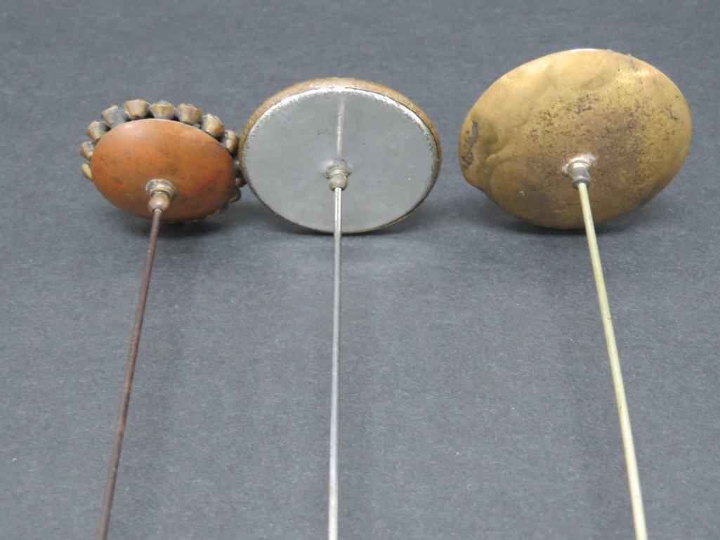 Three large hat pins and hat pin holder