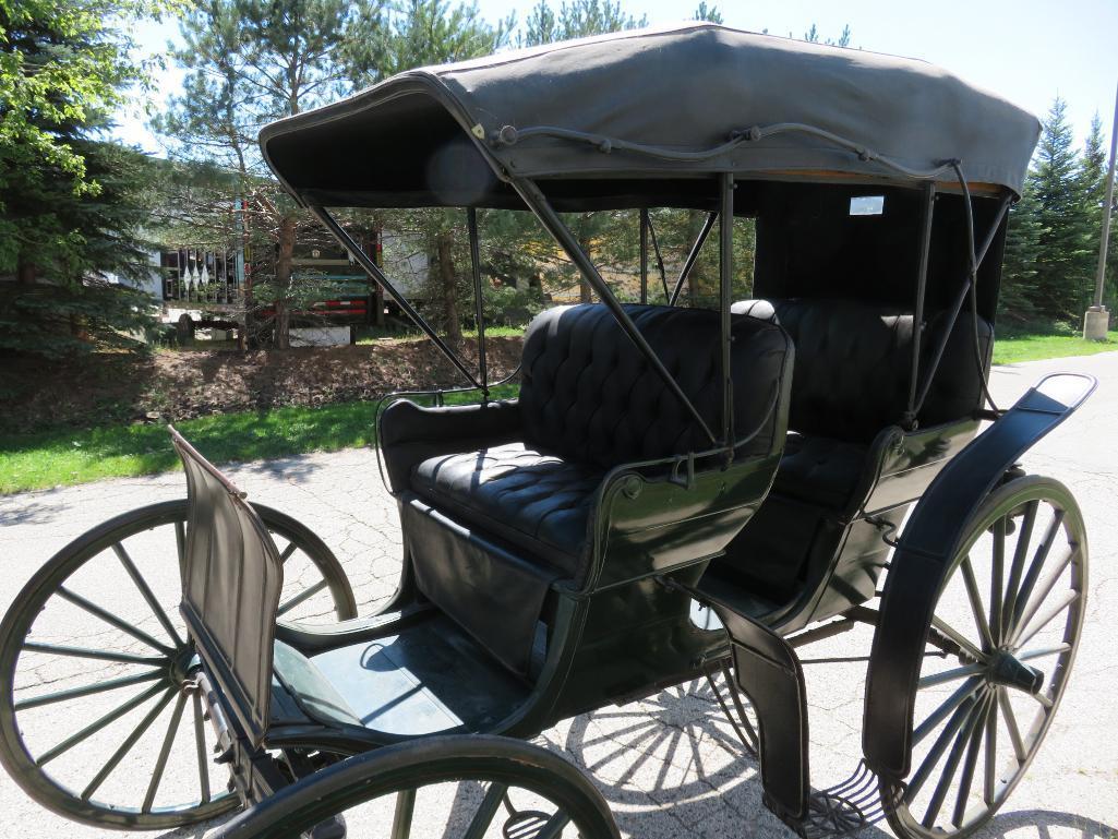 Two seater carriage with top