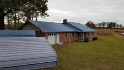 Approx. 31 acres containing 3 ponds, 1 Large Metal Barn, 1 small storage bu