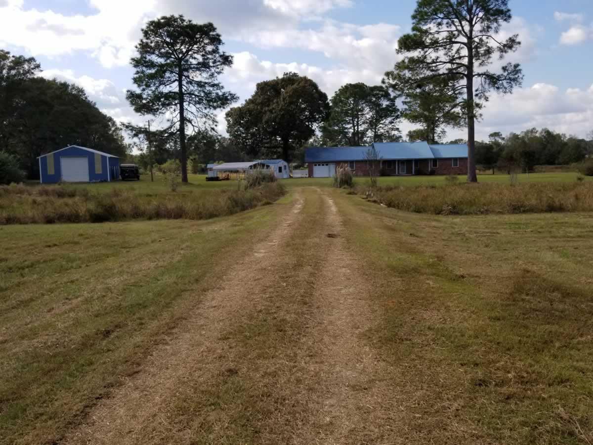 Approx. 31 acres containing 3 ponds, 1 Large Metal Barn, 1 small storage bu