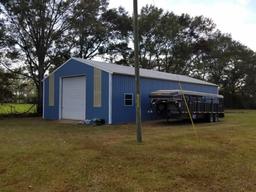 Approx. 31 acres containing 3 ponds, 1 Large Metal Barn, 1 small storage bu