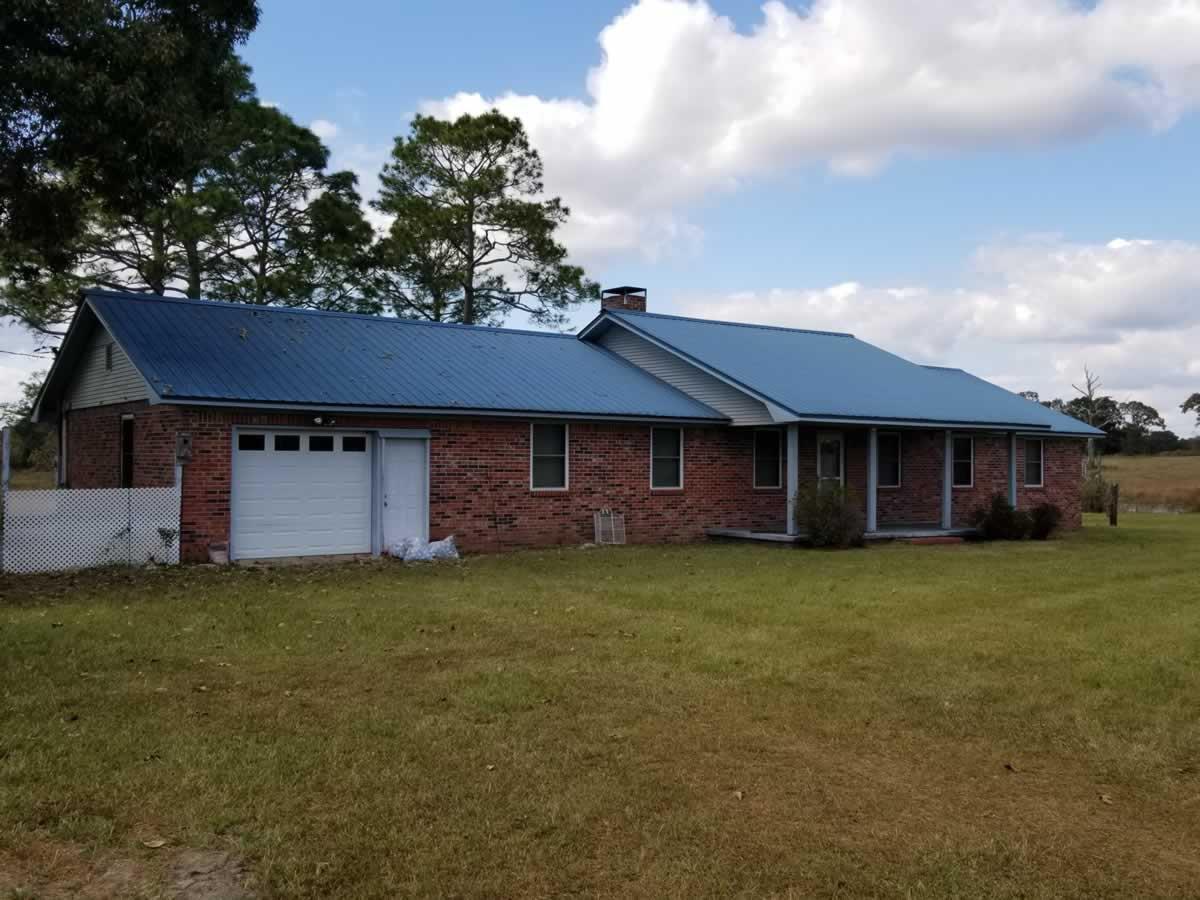 Approx. 31 acres containing 3 ponds, 1 Large Metal Barn, 1 small storage bu