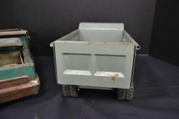 Pair of Structo Dump Trucks, 1 Deluxe, 1 rough, metal and plastic accessori