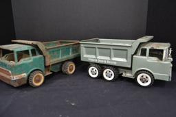 Pair of Structo Dump Trucks, 1 Deluxe, 1 rough, metal and plastic accessori