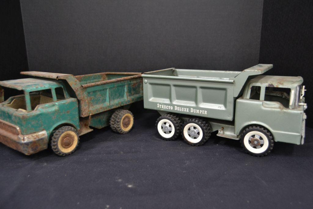 Pair of Structo Dump Trucks, 1 Deluxe, 1 rough, metal and plastic accessori
