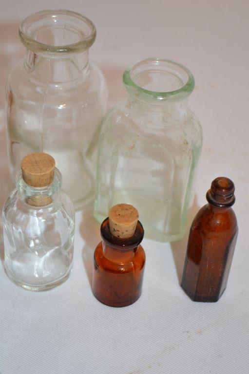 Group of 9 Small Bottles, some with Corks