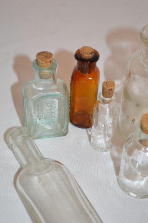 Group of 9 Small Bottles, some with Corks