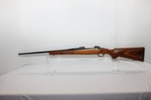 Ruger M77 .30-06 Cal. Bolt Action Rifle w/Laminated Wood Stock, Adj. Trigger, and Tang Safety; SN 77