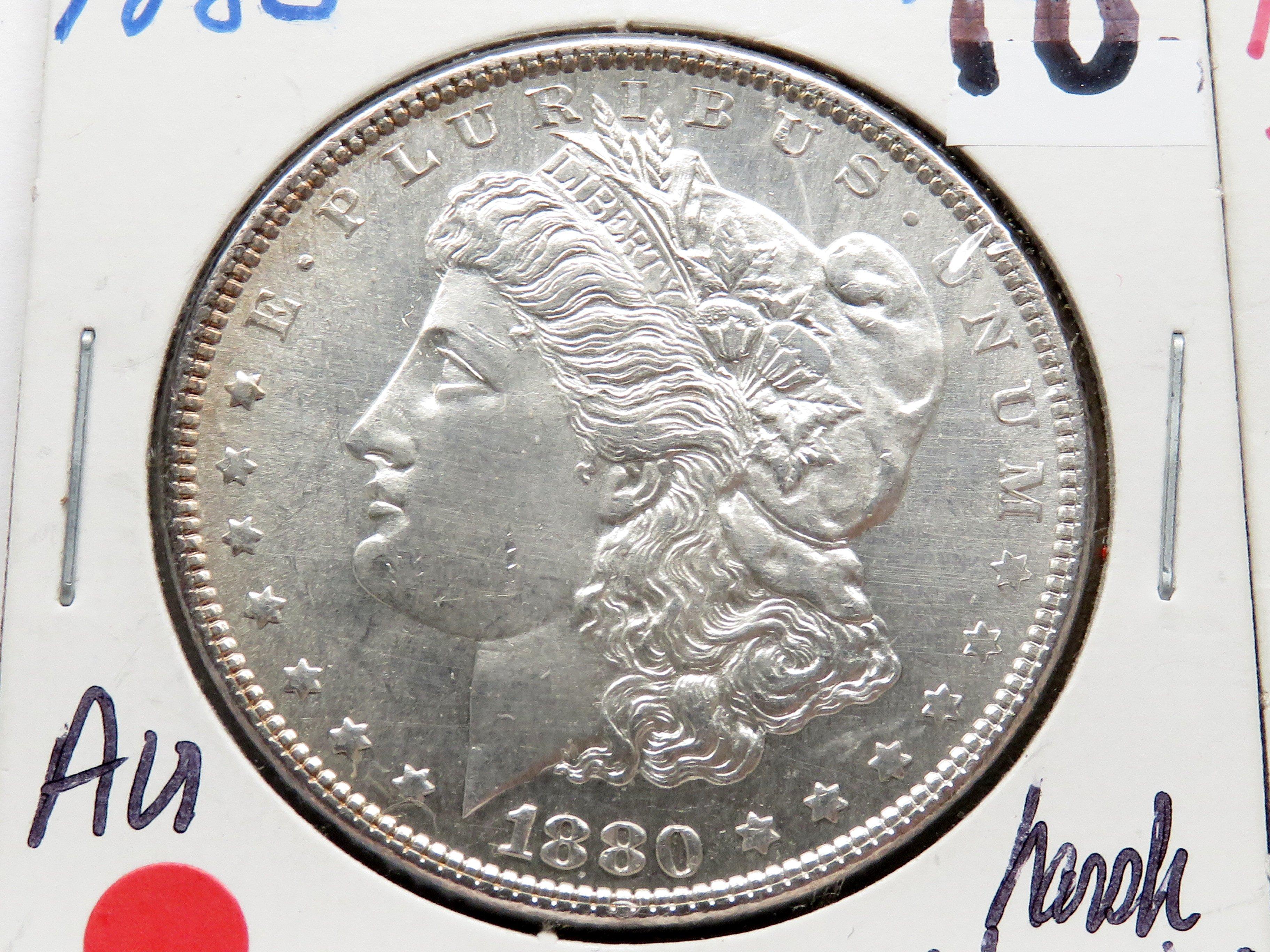 2 Morgan $ : 1880 AU harshly cleaned, 1880S AU cleaned