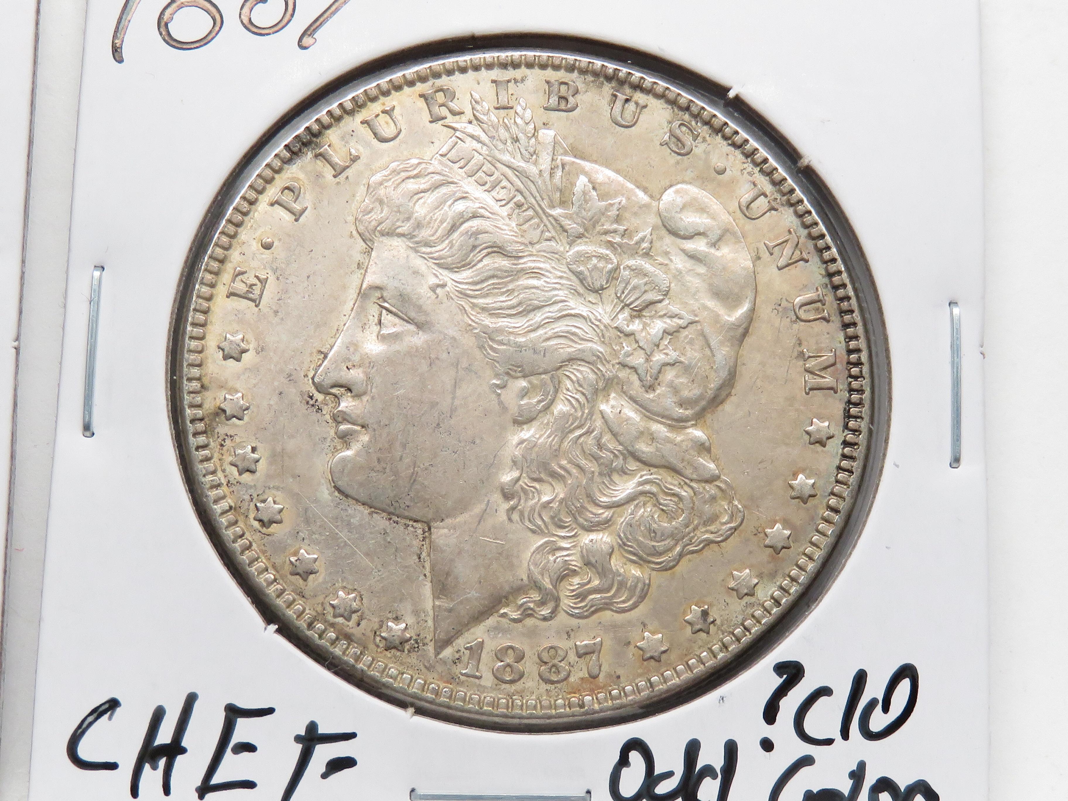 2 Morgan $: 1886 AU toned, 1887 CH EF ?cleaned odd color