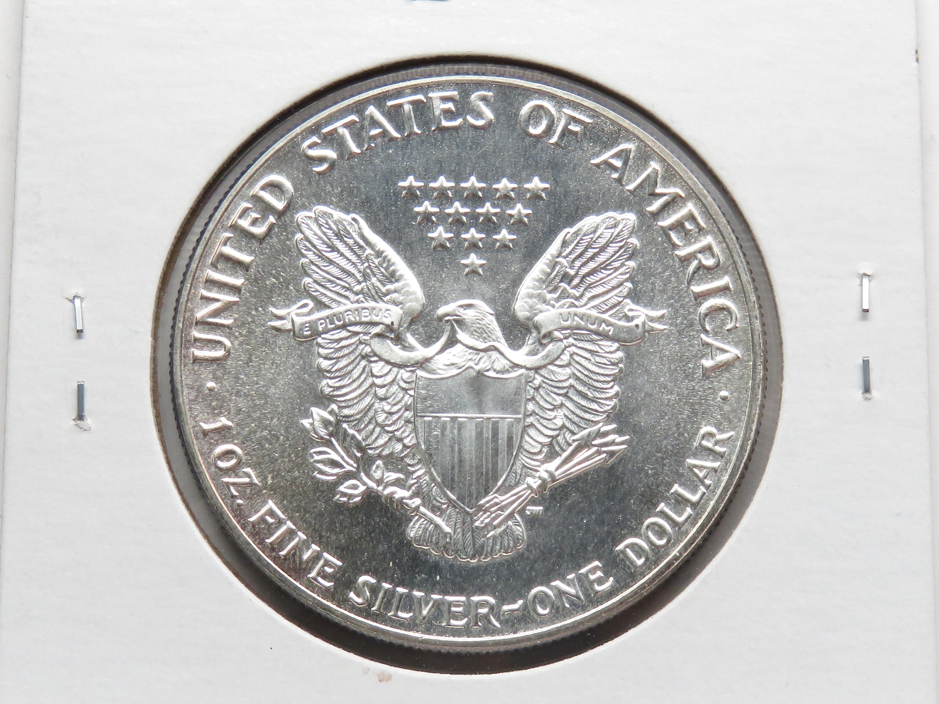 1987 Silver American Eagle CH BU light toning