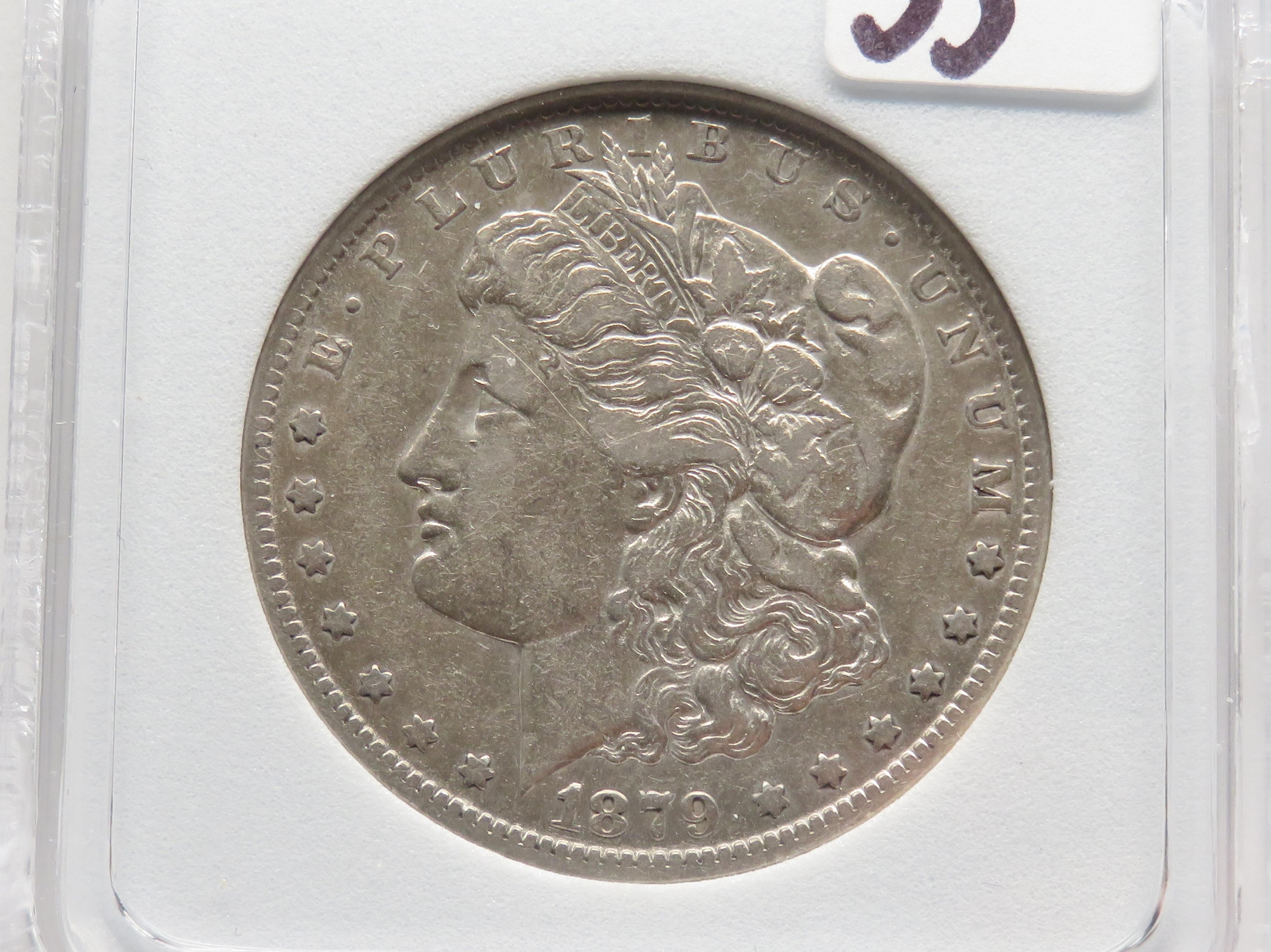 Morgan $ 1879-CC NNC AU55 Capped Die (Better date)