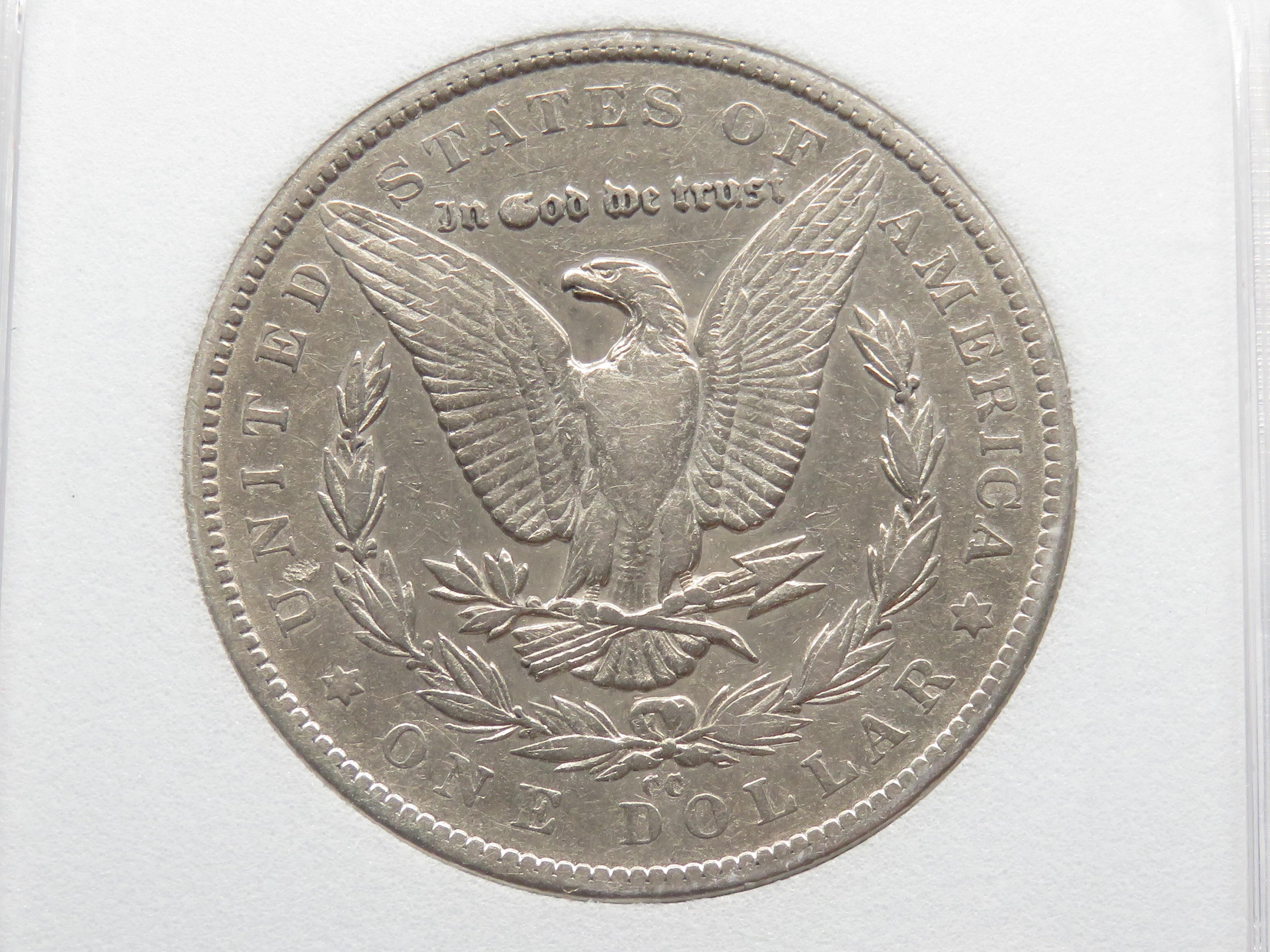 Morgan $ 1879-CC NNC AU55 Capped Die (Better date)