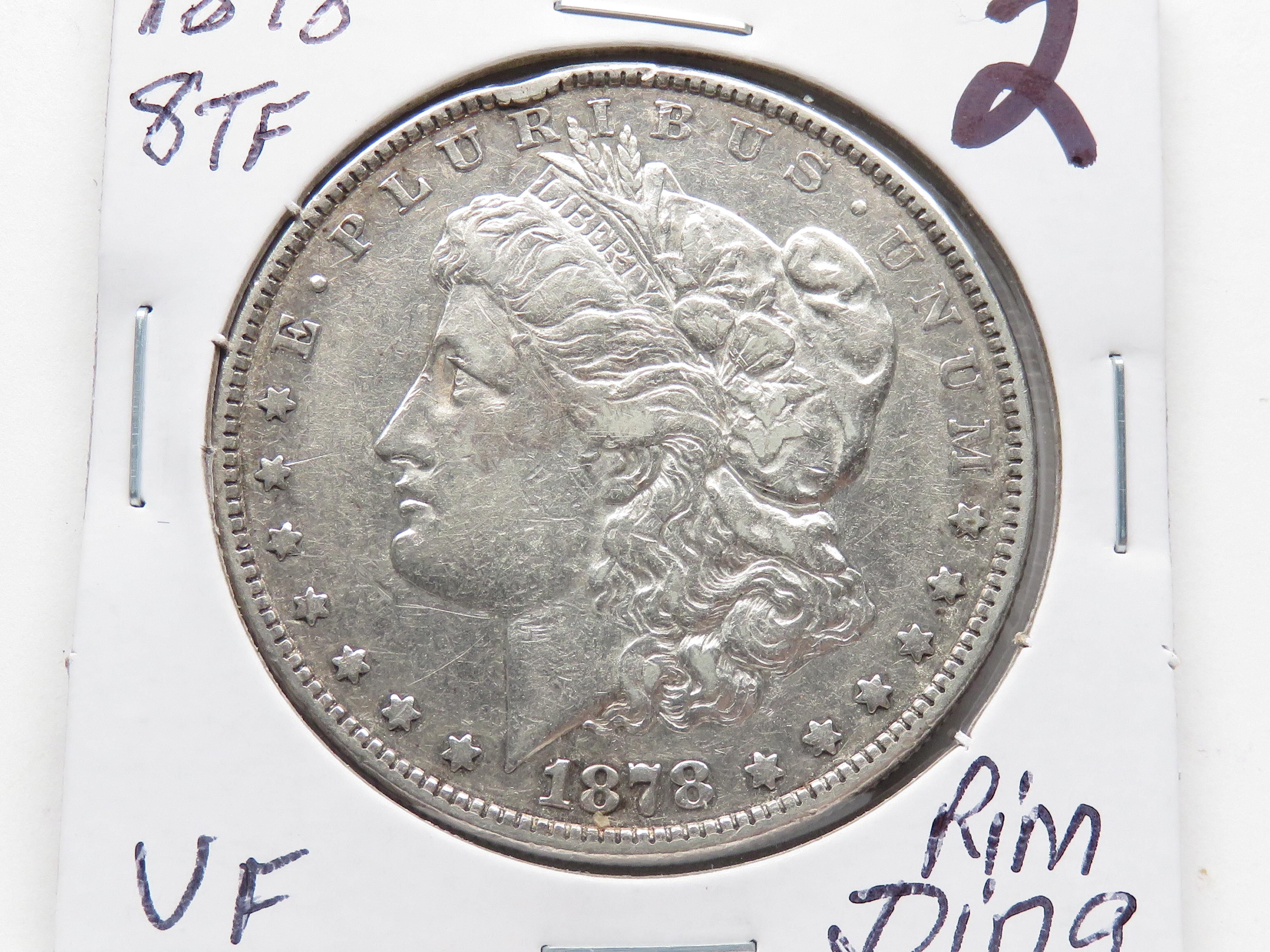 Morgan $ 1878 8 TF rim ding VF