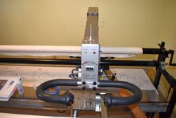 Millennium APQS Laser Quilting Machine, 10' bed, laser light, stitch regulator, 15 pantograph