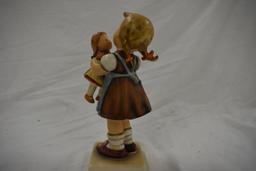 Hummel girl and doll figurine