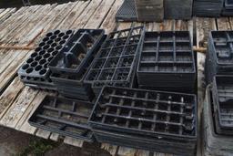 Assortment of bamboo sticks and plastic plant trays, located in GH 24