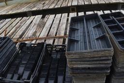 Assortment of plastic trays and pots , located in GH 24