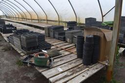 Approx. 180' of wooden greenhouse garden benches 60" and 84" wide with cinder blocks,