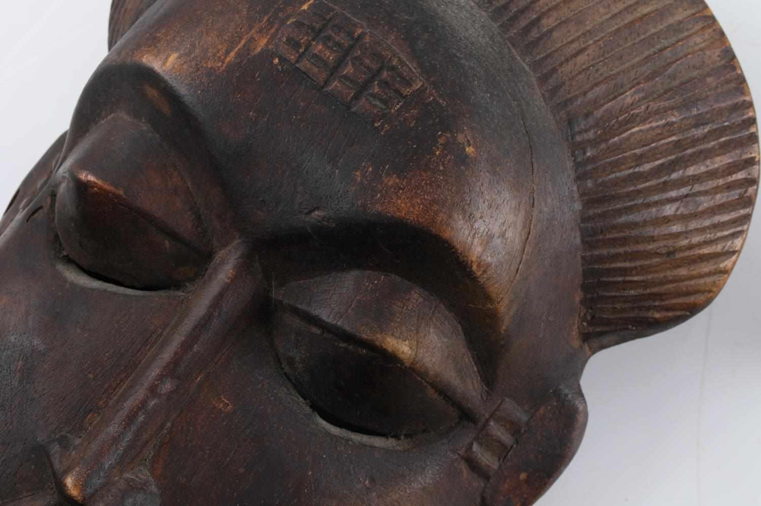 CHAMORI AND IVORY COAST CARVED WOOD TRIBAL MASK