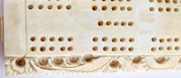 ANTIQUE IVORY CRIBBAGE GAME BOARD WITH PEGS