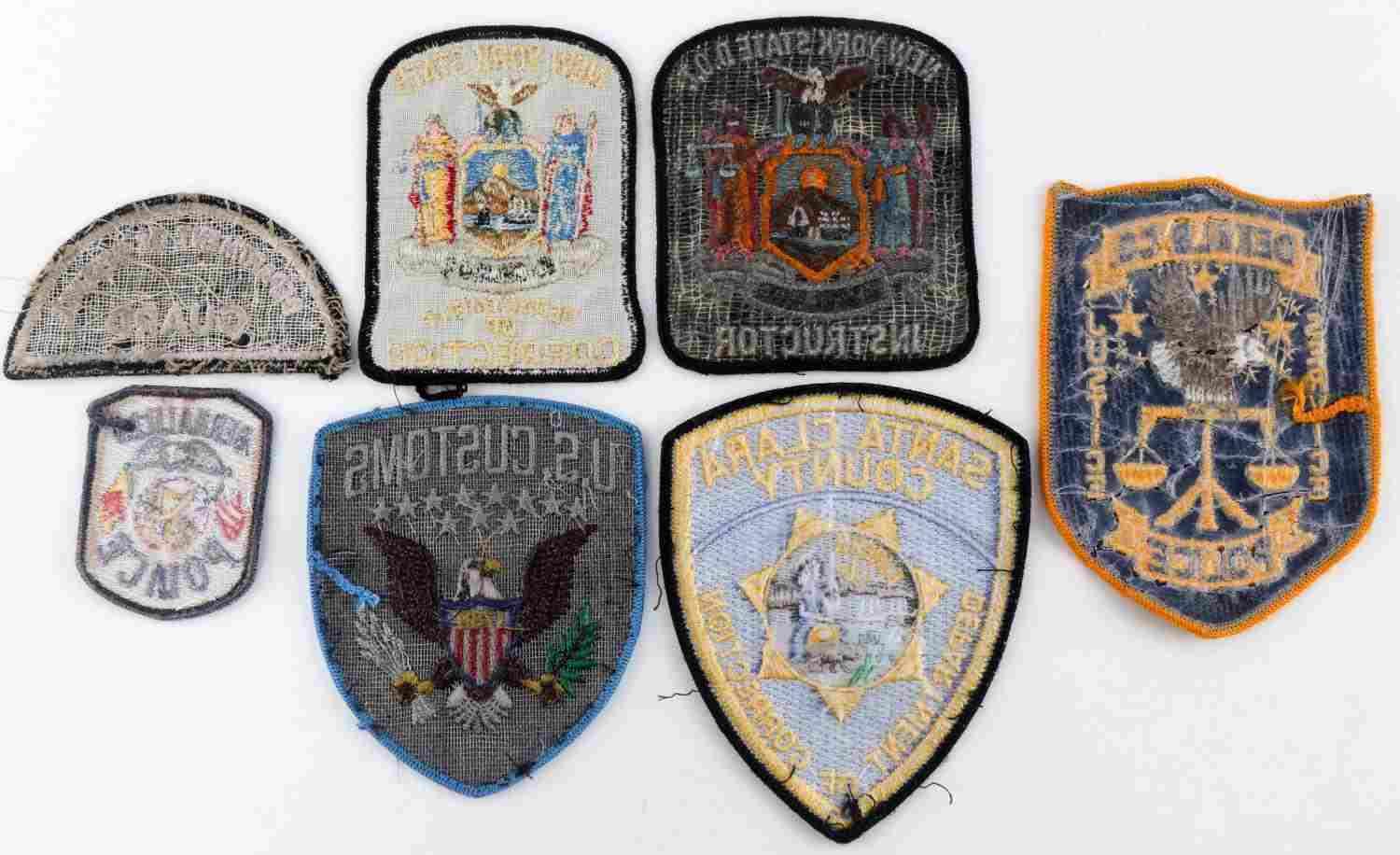 LOT OF SEVEN VARIOUS POLICE BADGE PATCHES