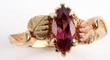 10KT ROSE AND YELLOW GOLD WITH GARNET RING