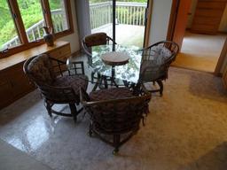 Round glass top table w/4 chairs on casters-48" D, sturdy wicker for chairs.