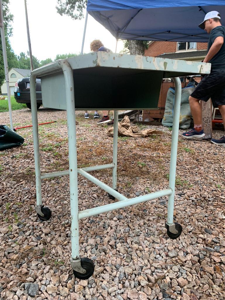 Cool vintage medical or industrial cart in pale green.