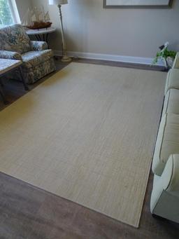 Light yellow rug w/ flecks of green-very good condition. 7'6" x 10'5".