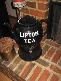 Hearth items: Star, ice tea dispenser, basket, candle, gold bucket w/kindling, tea pot and iron