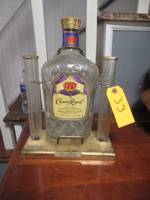 OLD BOTTLE OF CROWN ROYAL IN STAND