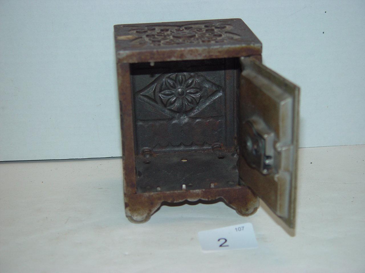 Cast iron combination lock coin bank by The J & E Stevens Co. 5” tall 3 pics