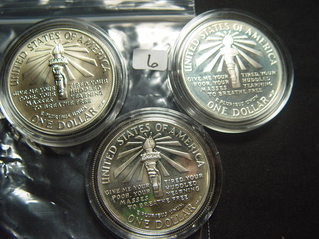 Three 1986 Statue of Liberty Silver Dollars: Two Proof & One BU