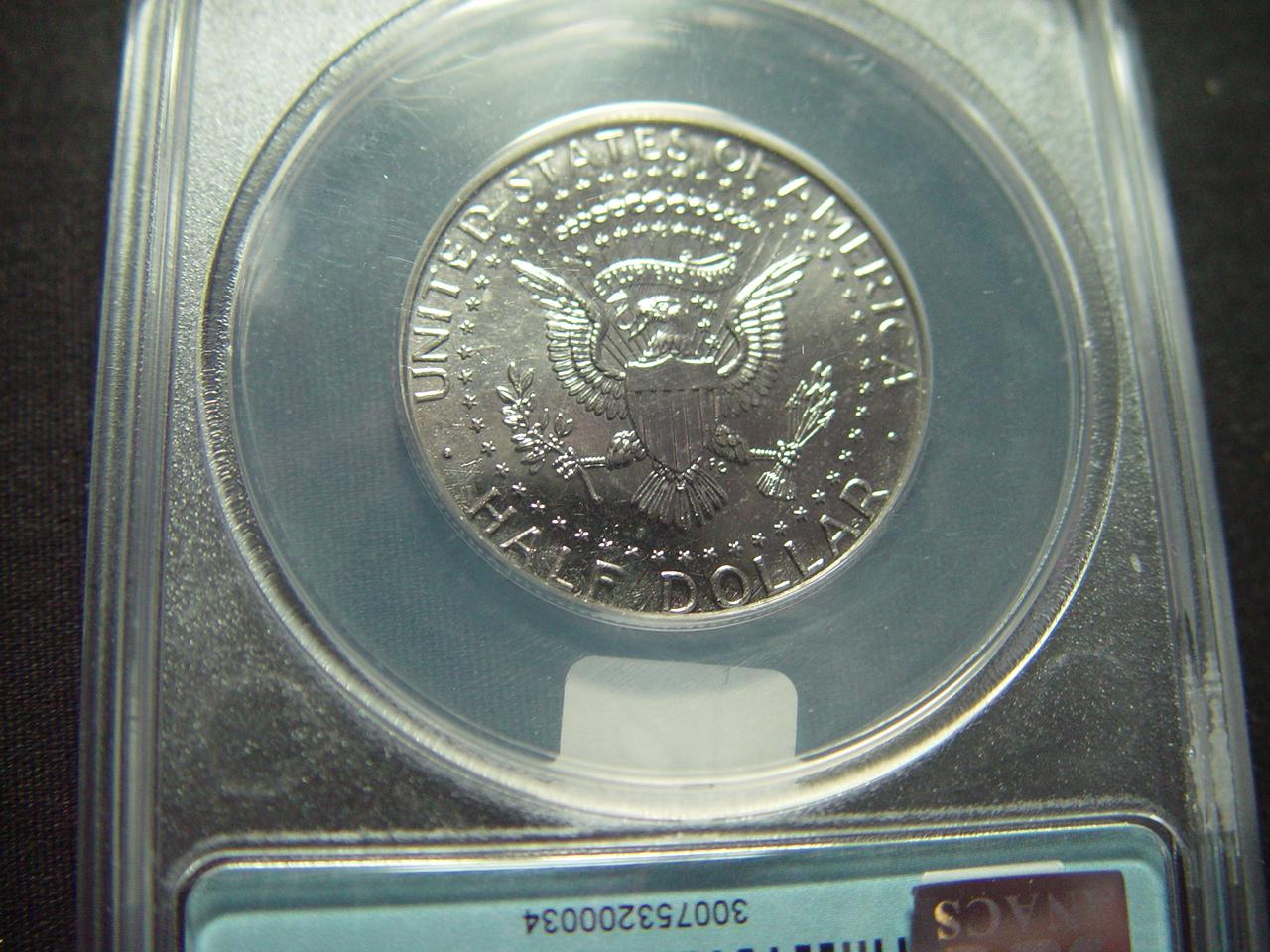 Mint Error: 2009 Kennedy Half Struck Through Grease  ANACS -Authentic