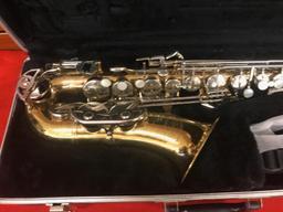 The Selmer Company Bundy 11 Alto Saxophone with case, finish is tarnished
