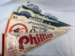 Group of vintage pennants, Phillies, Orioles, Padres, Bills, Cowboys, Jets