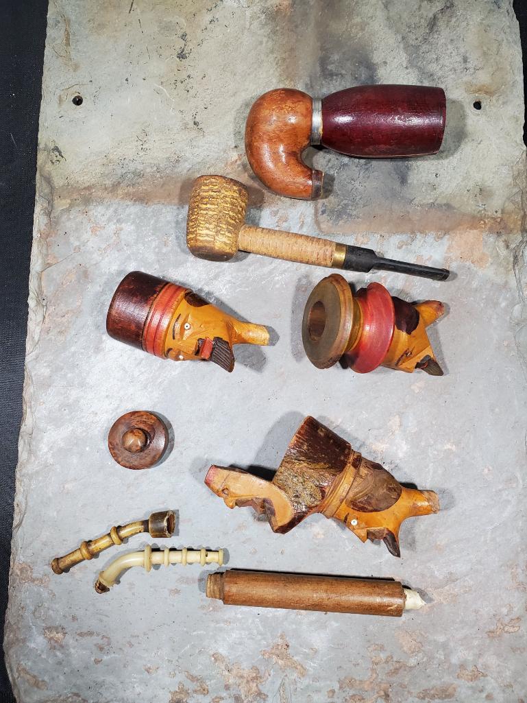 3 Carved faces, corn cob looking pipe cracked Missour Meershaum, and assorted pieces and parts