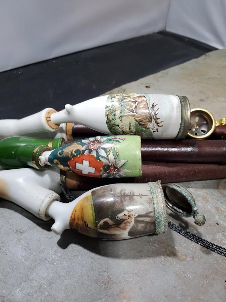 3 pipes, White porcelain with animal scene no markings, Green porcelain with flowers and shield no