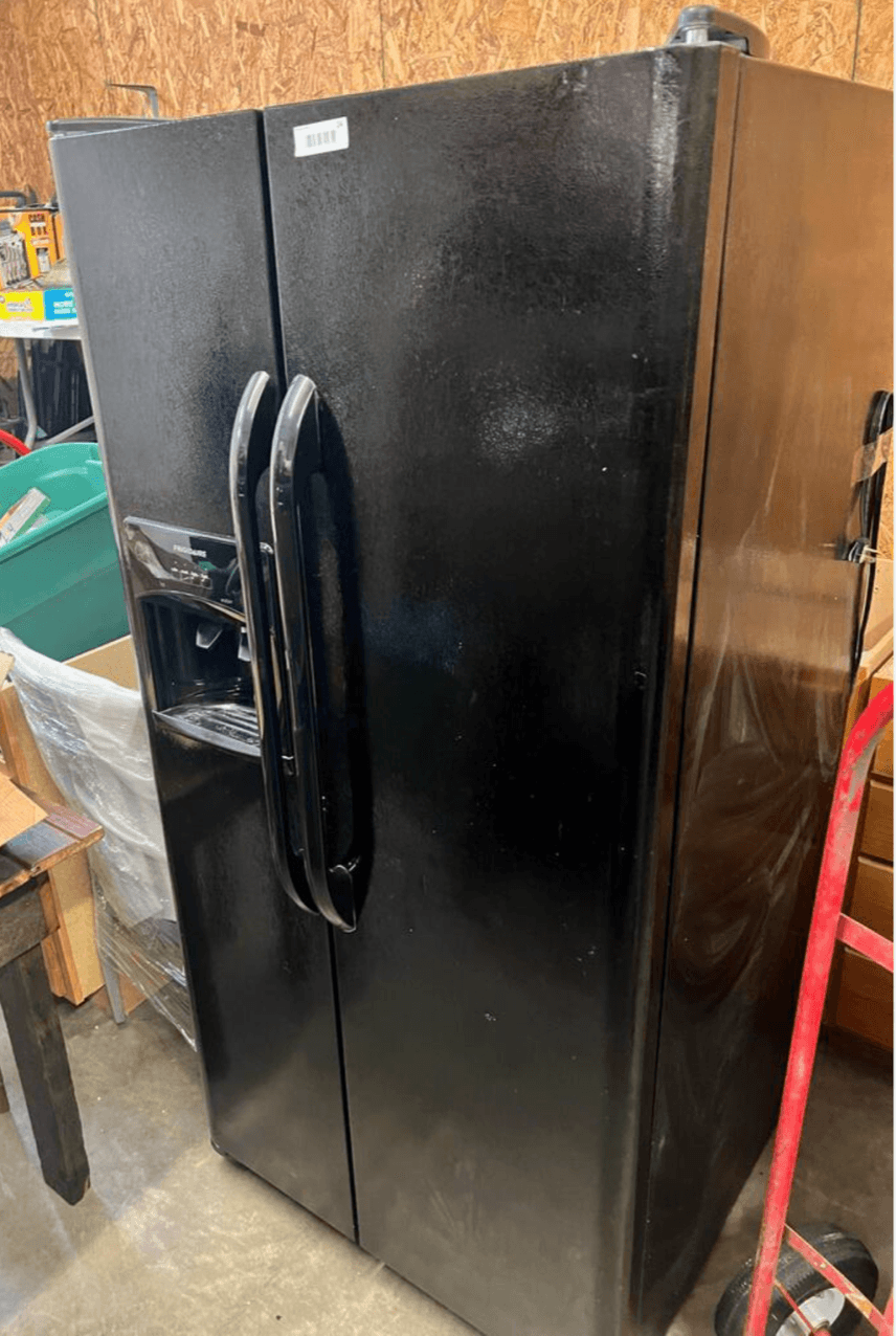 Frigidaire side by side black refrigerator, manufactured in 2015, 33.5 inches wide, 70 tall