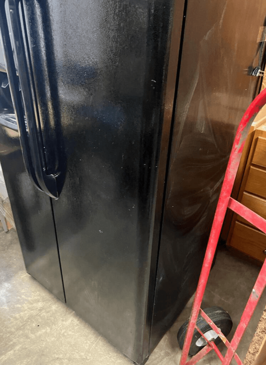 Frigidaire side by side black refrigerator, manufactured in 2015, 33.5 inches wide, 70 tall