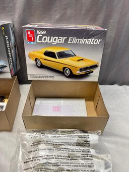 Pair of AMT 1/25th scale model kits, 1969 Cougar Eliminator and1966 Ford Thunderbird