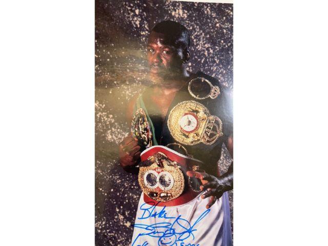 2 James â€œBusterâ€� Douglas signed photos